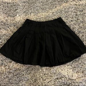 Pleated black mini skirt